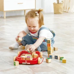 Hape Chariot à roulettes avec blocs empilables