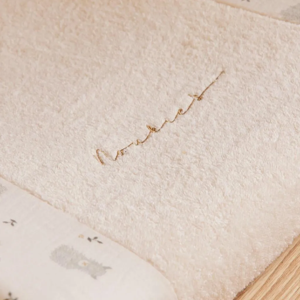 Noukie's Housse de matelas à langer en éponge écrue