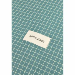 Nobodinoz Matelas à langer Stories Édition limitée Teal cream grid